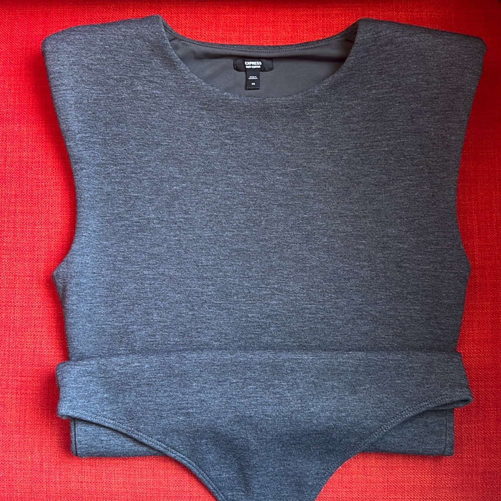 Express body contour bodysuit, worn once. Shoulder pads and jersey material